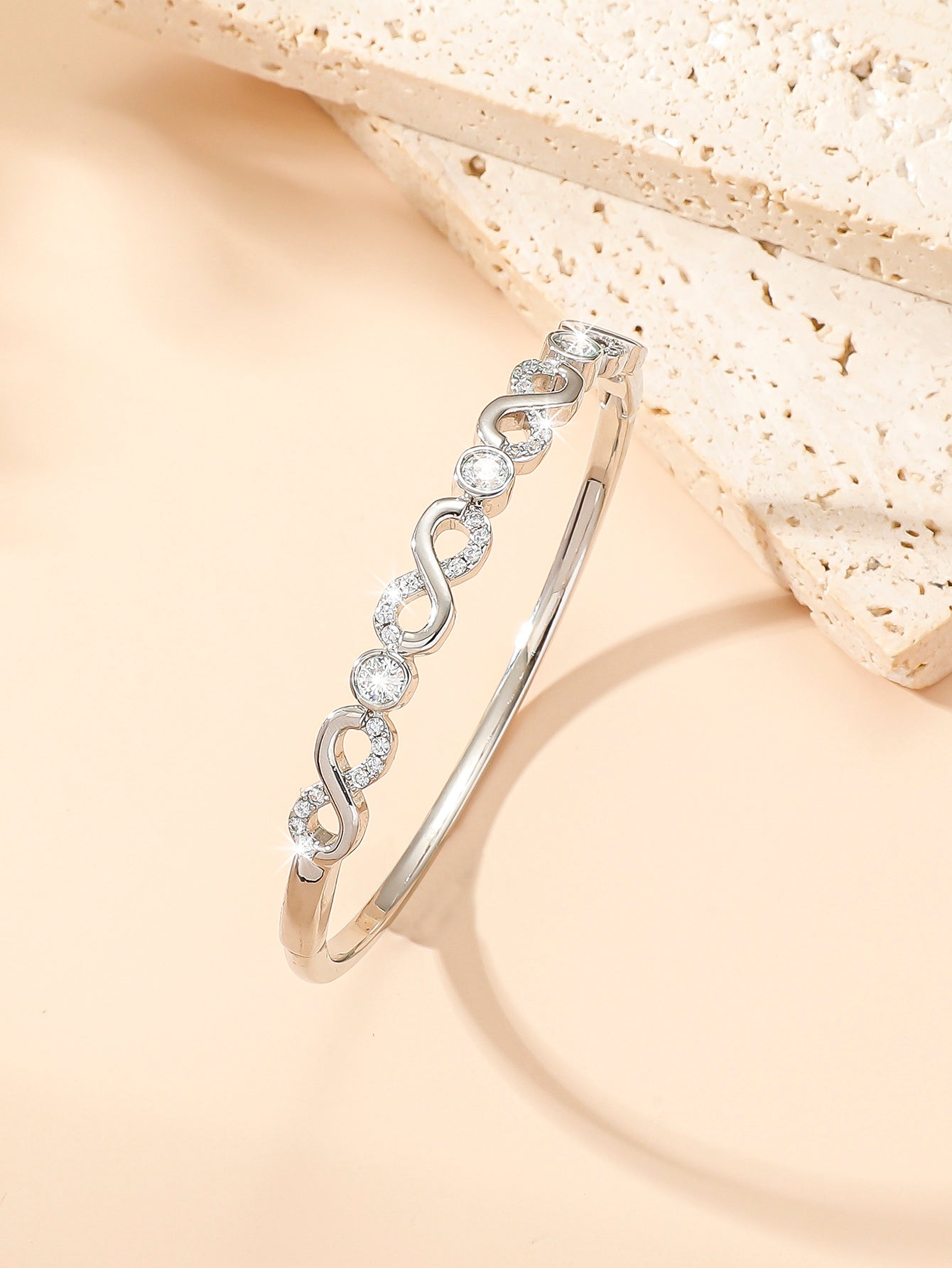 Women Sparkly Infinity Cubic Zirconia Bangle in Silver Tone