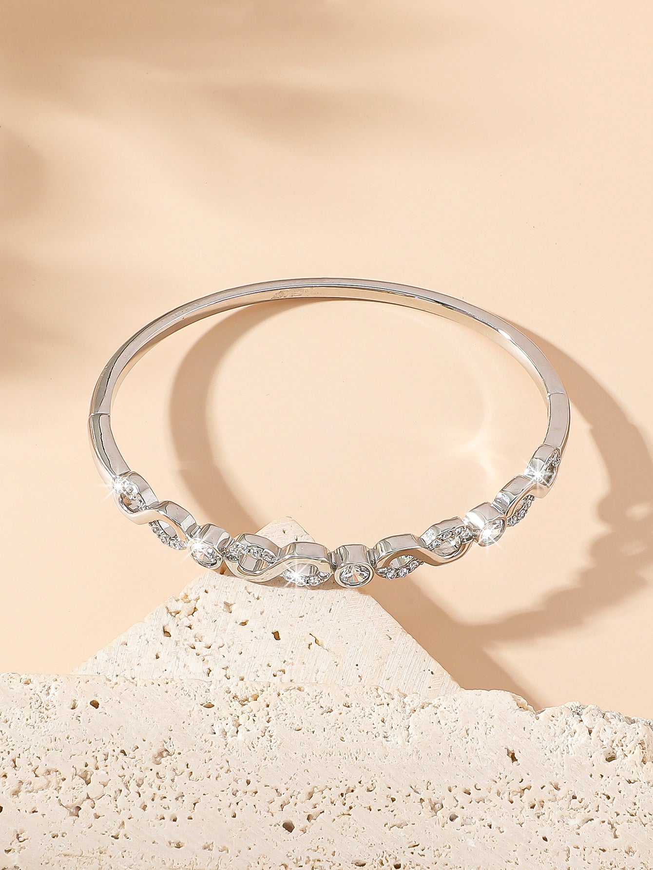 Women Sparkly Infinity Cubic Zirconia Bangle in Silver Tone