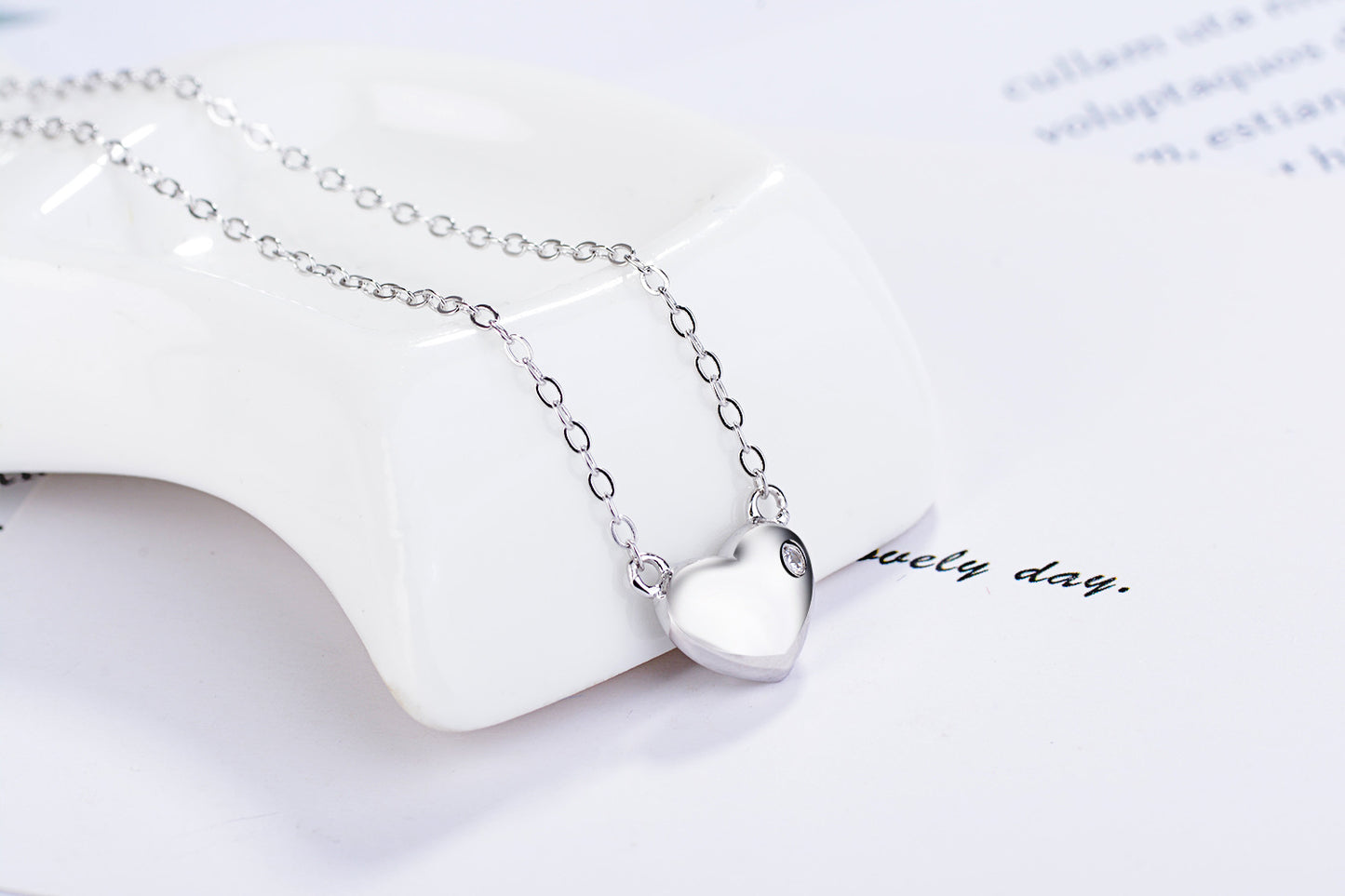 A Moissanite On The Heart Shape Silver Pendant Necklace