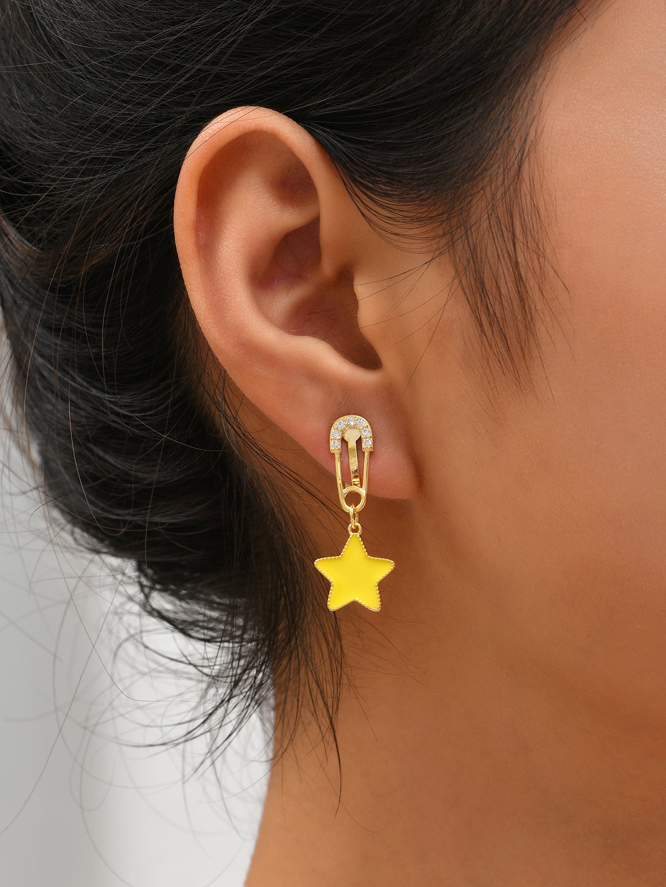 Star Dangle Mismatched Non Pierced Clip On Earrings in Golden Tone with Zirconia