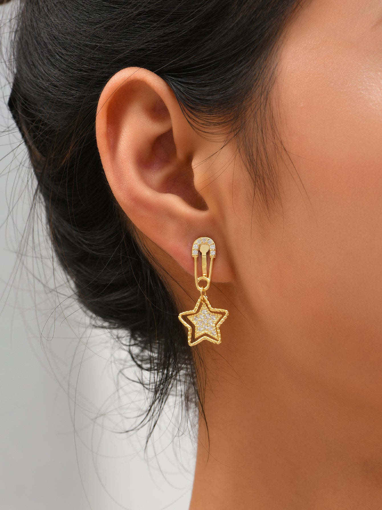 Star Dangle Mismatched Non Pierced Clip On Earrings in Golden Tone with Zirconia