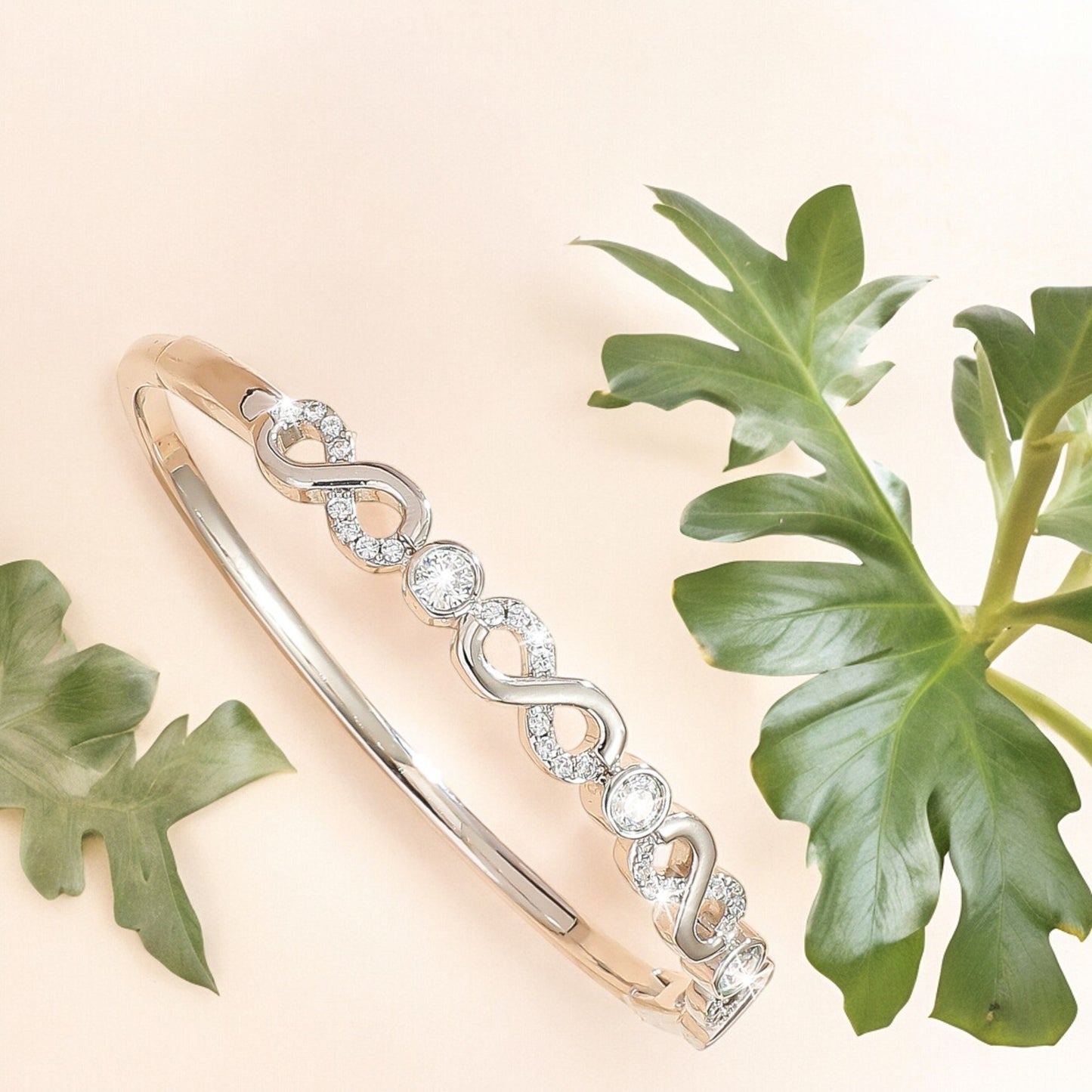 Women Sparkly Infinity Cubic Zirconia Bangle in Silver Tone