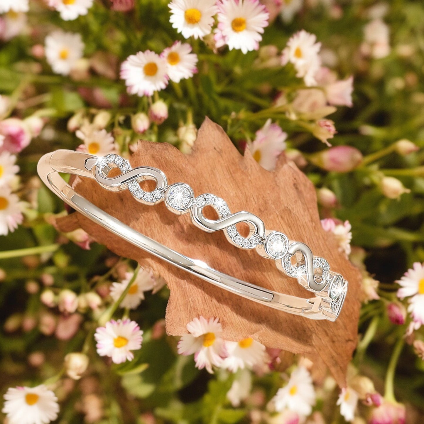 Women Sparkly Infinity Cubic Zirconia Bangle in Silver Tone