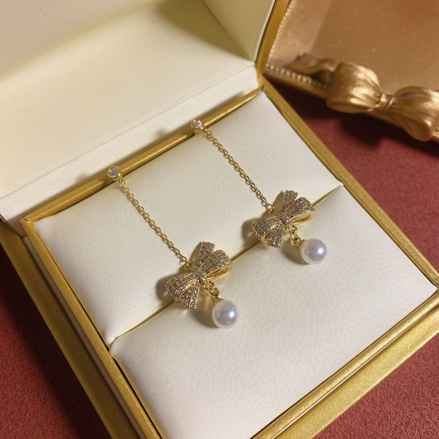 Women Crystal Bow with Pearl Drop Earrings in Gold Tone
