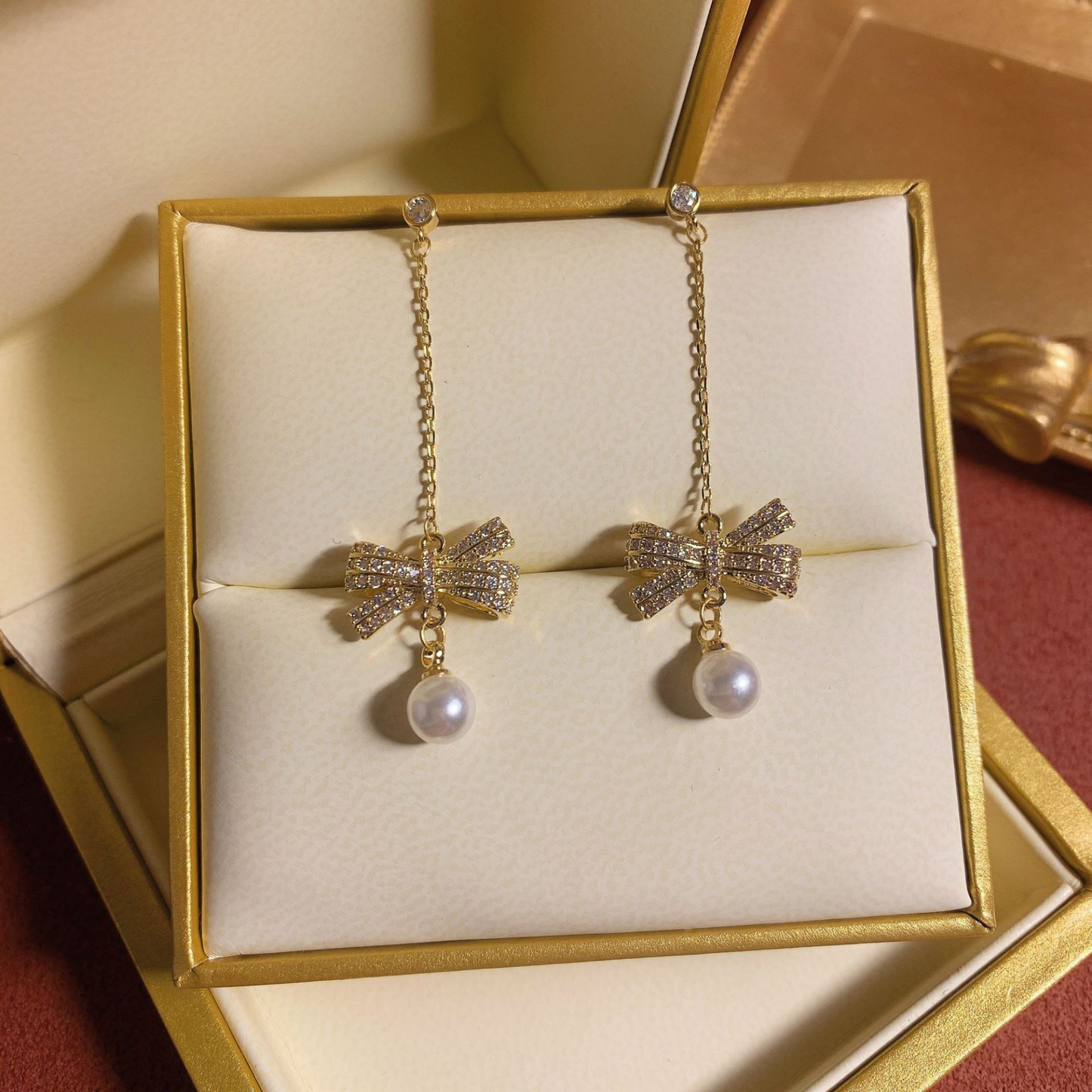Women Crystal Bow with Pearl Drop Earrings in Gold Tone