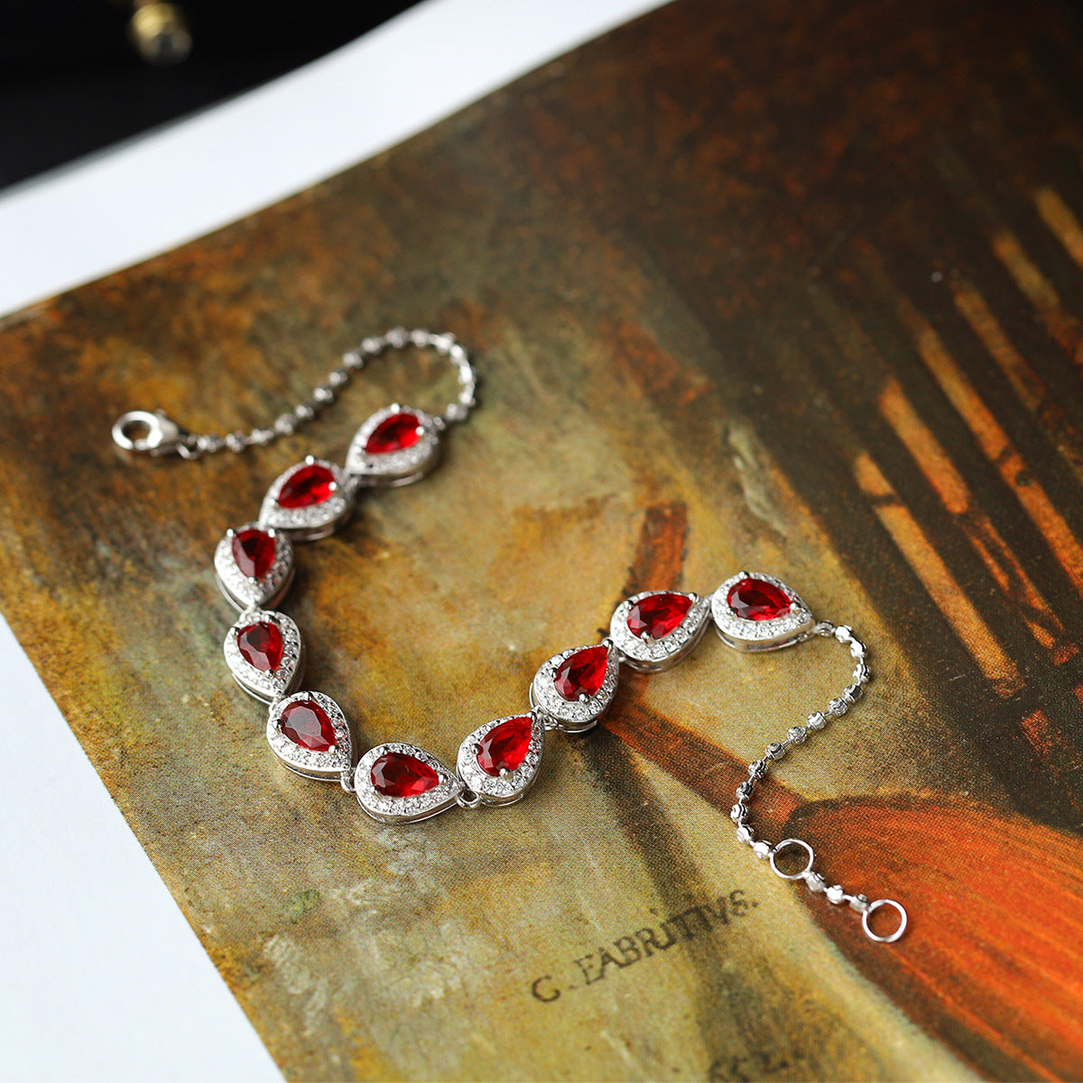 Sterling Silver Ruby Teardrop Tennis Bracelet with Cubic Zirconia