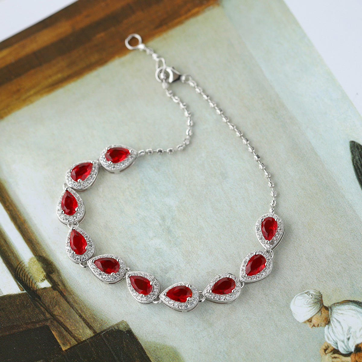 Sterling Silver Ruby Teardrop Tennis Bracelet with Cubic Zirconia