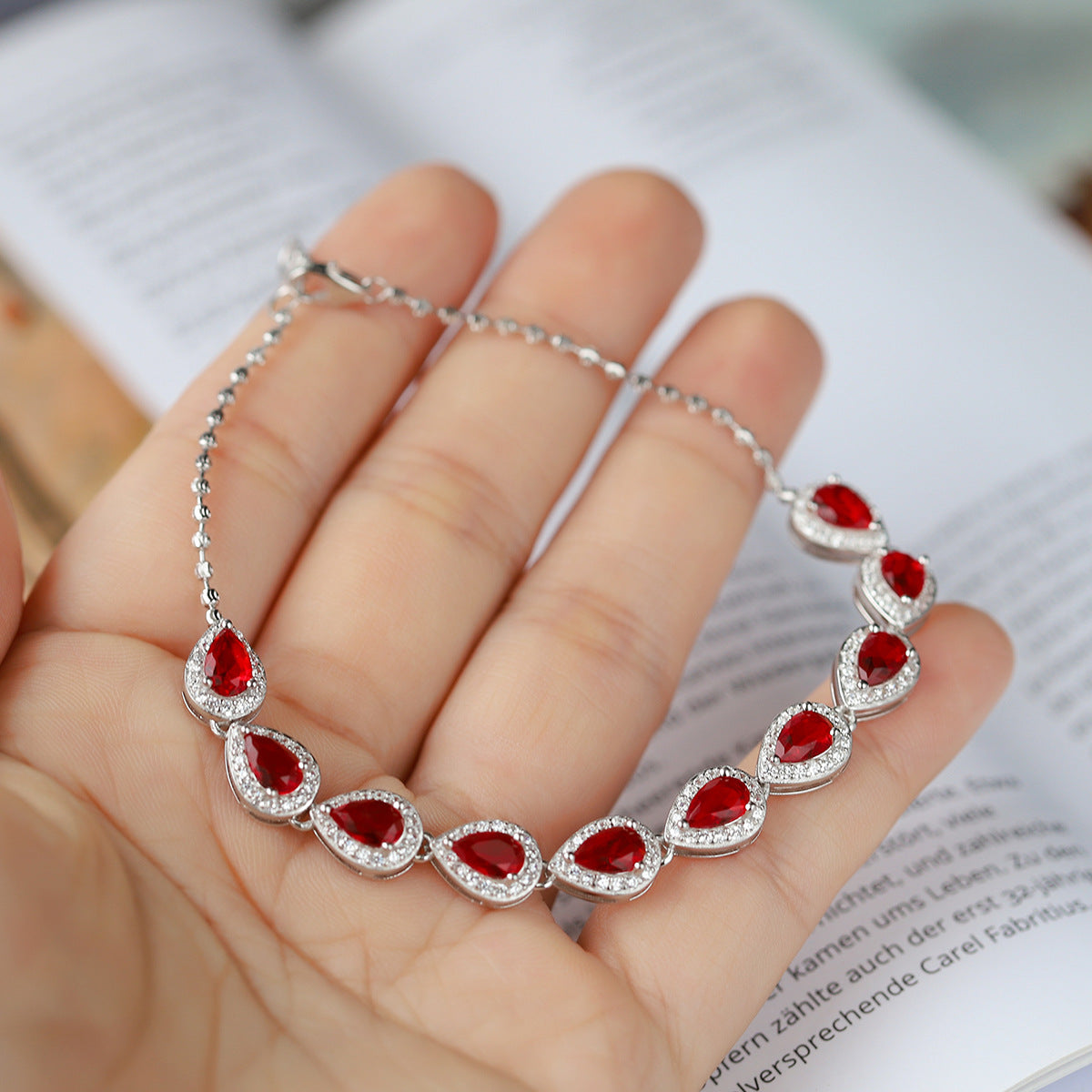 Sterling Silver Ruby Teardrop Tennis Bracelet with Cubic Zirconia